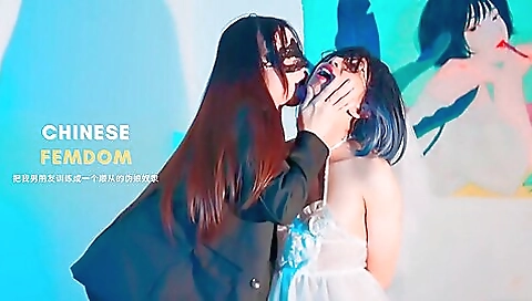 Asian woman in sexy chinese outfit gets fucked by a dildo