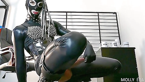 A guy is fucking the big cock latex dildo in front of me