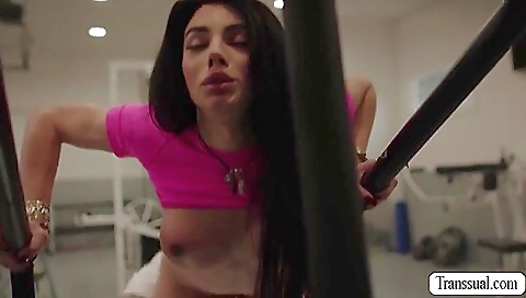 Brunette in gym is getting licked on her legs and pussy